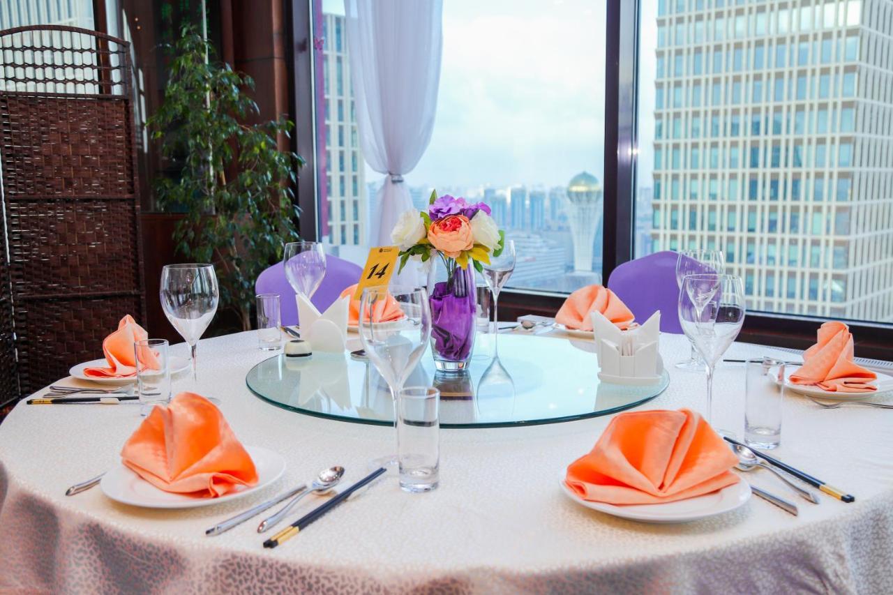 Beijing Palace Soluxe Hotel Astana Exterior photo A table set for a banquet