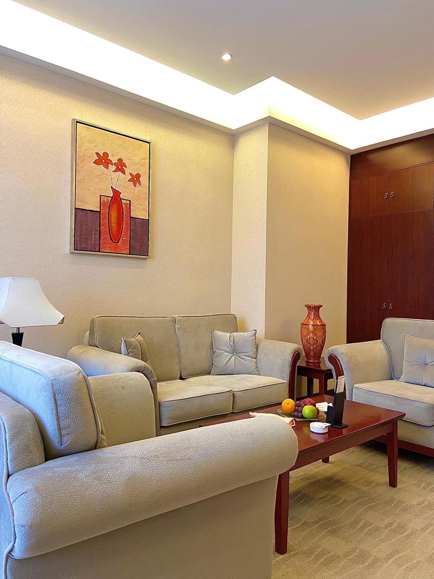 Beijing Palace Soluxe Hotel Astana Exterior photo A living room in a typical apartment